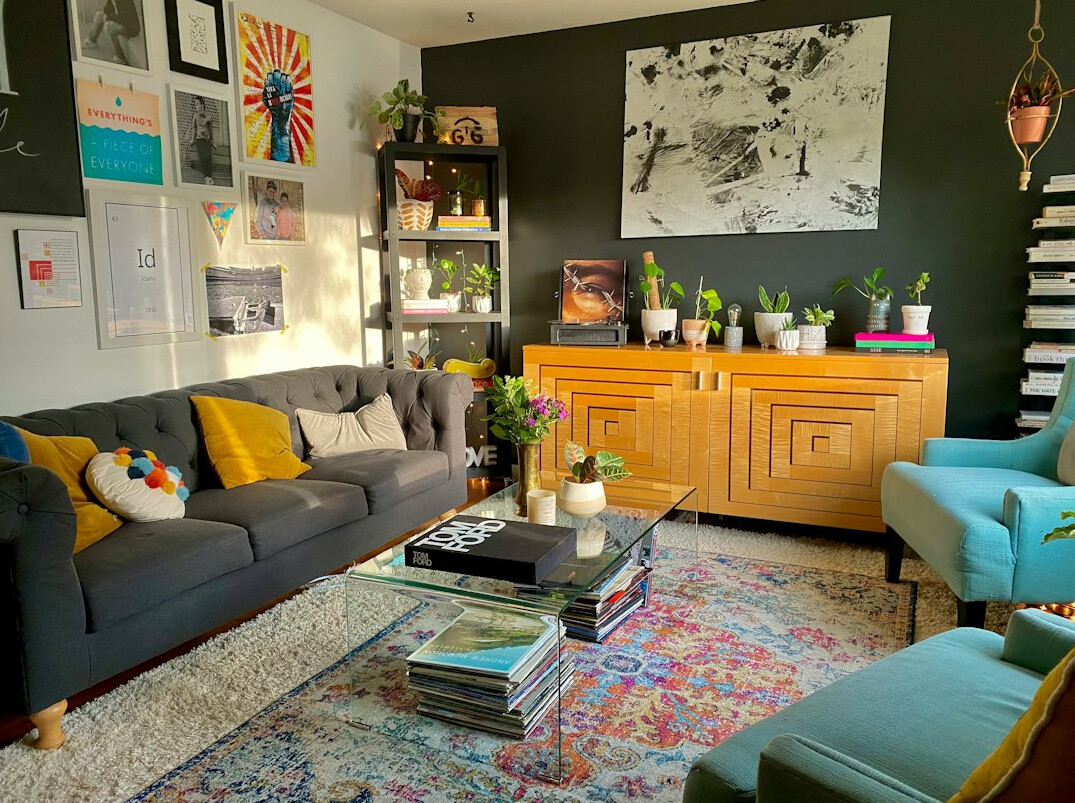 Bold 1980s eclectic living room styling with patterned textiles and brass accents